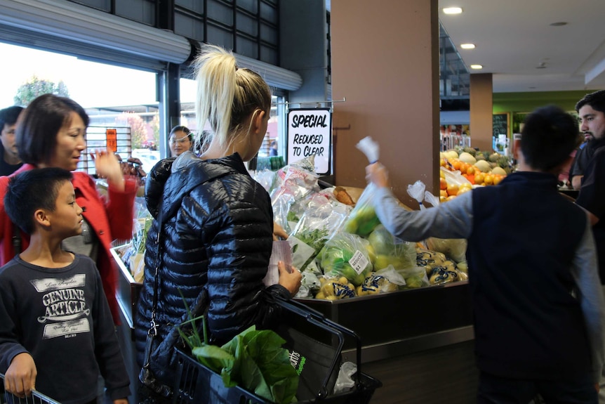 Shoppers queue for discounted stock at the Fyshwick Markets on Sunday afternoon. April, 2017.