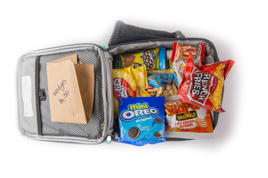 A lunch order for wedges, biscuits, two packets of chips, chicken flavoured Shapes, lollies and a fruit box in a cooler bag