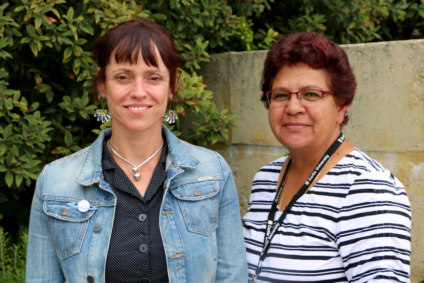 A mid-shot of Mandy Wilson and Jocelyn Jones posing for a photo outdoors.