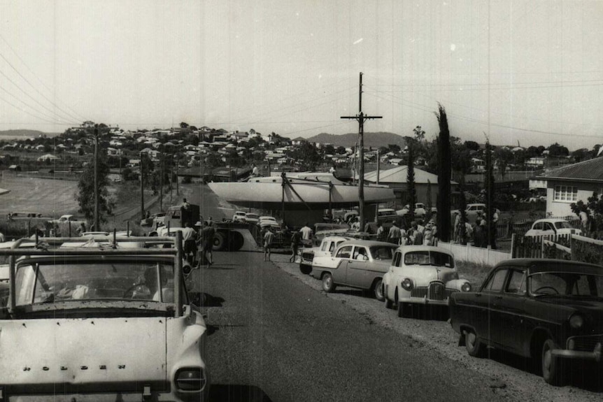 Historic photo of the handmade Patrick family yacht Wistari being transported to Gladstone harbour in 1965.