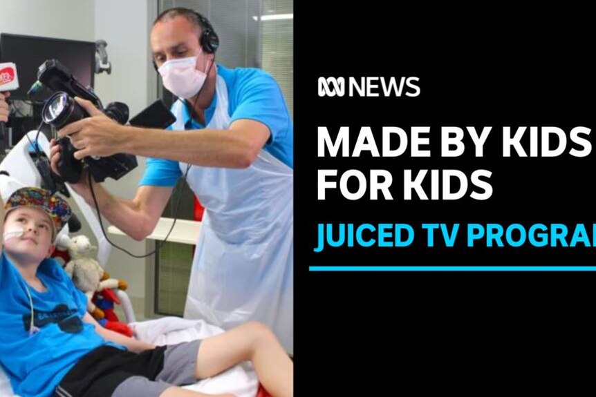 Made by Kids for Kids, Juiced TV Program: A child in a hospital bed holds a microphone up while a man holds a camera.