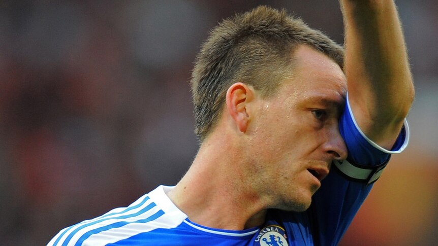 Chelsea captain John Terry wiping sweat from his brow