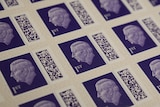A series of purple stamps featuring King Charles. 