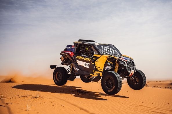 A rally car gets airborne over a sand dune during a race in Saudi Arabia.