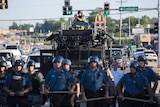 Riot police stand guard in Ferguson, Missouri, on August 13.