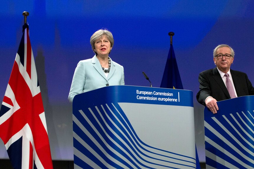 British Prime Minister Theresa May, left, stands next to European Commission President Jean-Claude Juncker