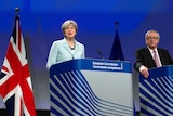 British Prime Minister Theresa May, left, stands next to European Commission President Jean-Claude Juncker