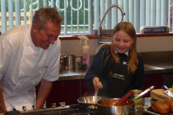 Scottish schoolgirl Martha Payne (right) shown with chef Nick Nairn