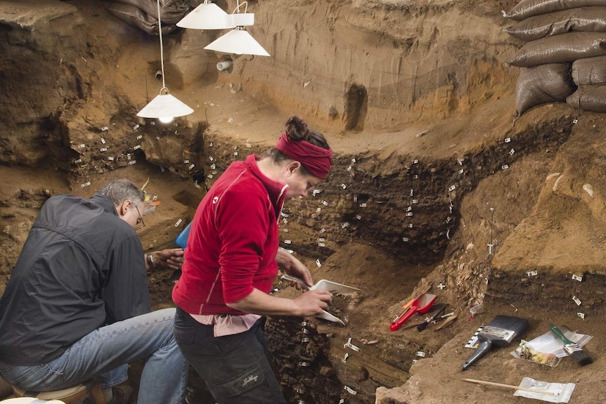 Archaeologists working inside Blombos Cave