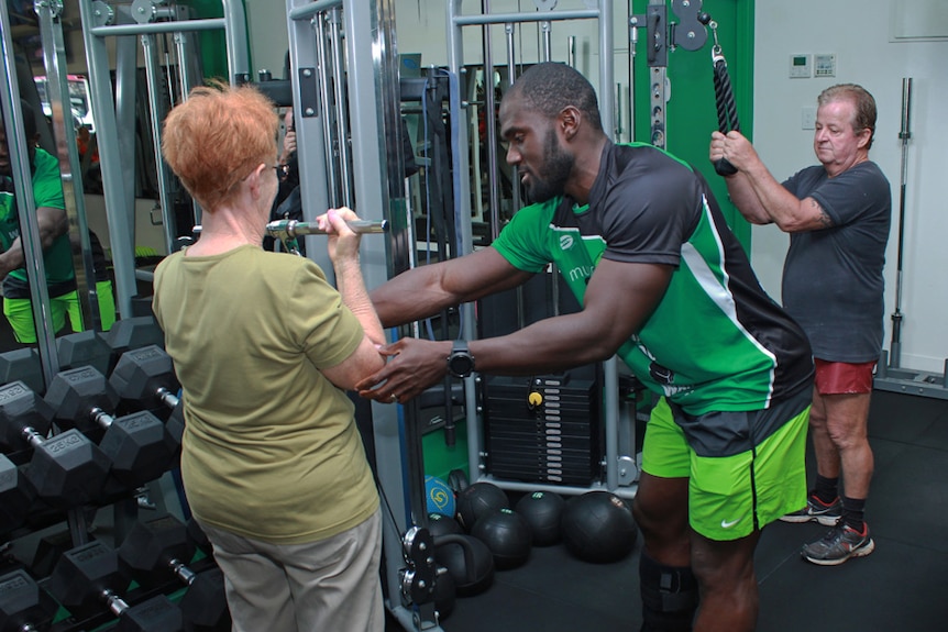 Kay helping seniors with weights