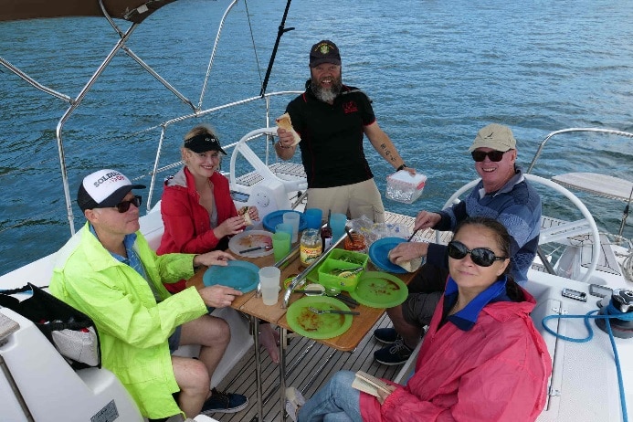 Feeding the "crew within" anchored near Manly, Sydney Harbour.