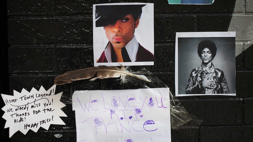 Photos of Prince are attached to the wall outside of the First Avenue nightclub where fans have created a memorial.