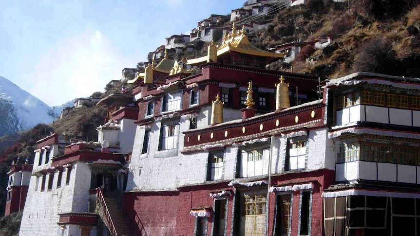 A Tibetan monastery perched on the edge of a cliff