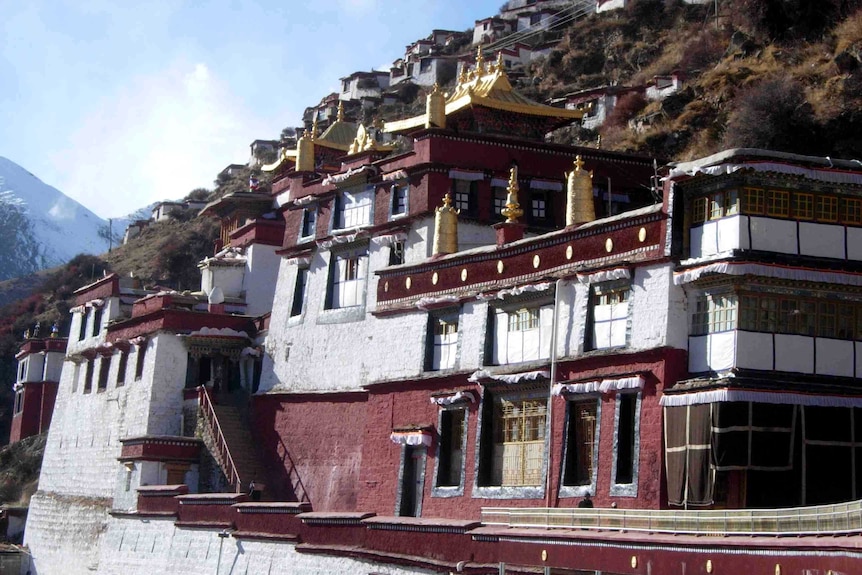 A Tibetan monastery perched on the edge of a cliff