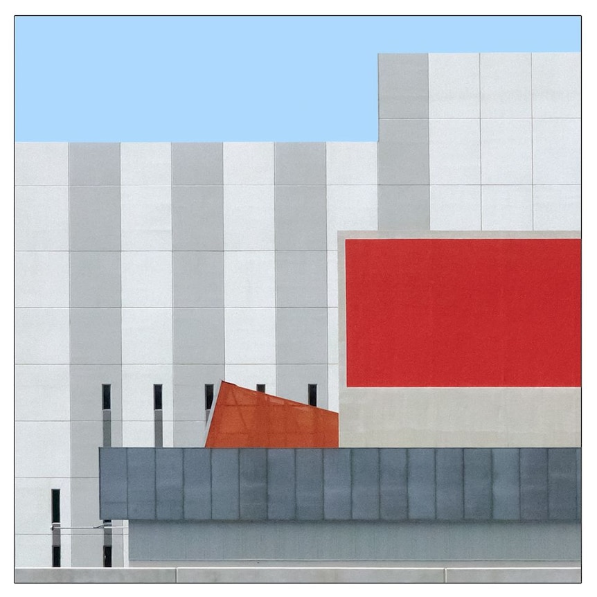 A close up of a white building with a red rectangle in the Perth CBD.
