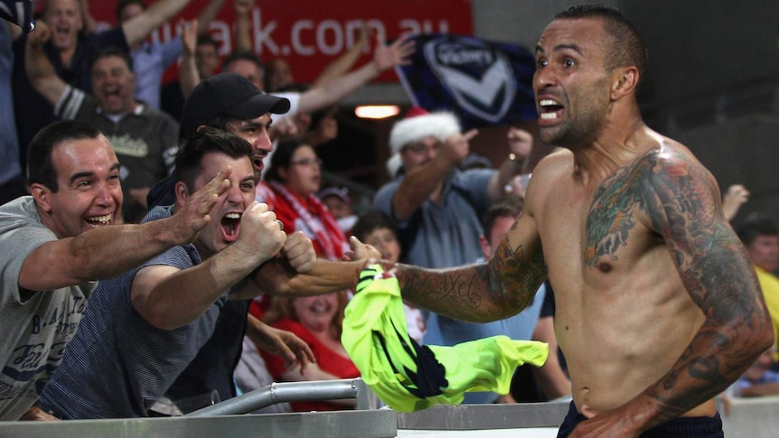Derby delight ... Archie Thompson celebrates the Victory's winner against Melbourne Heart.