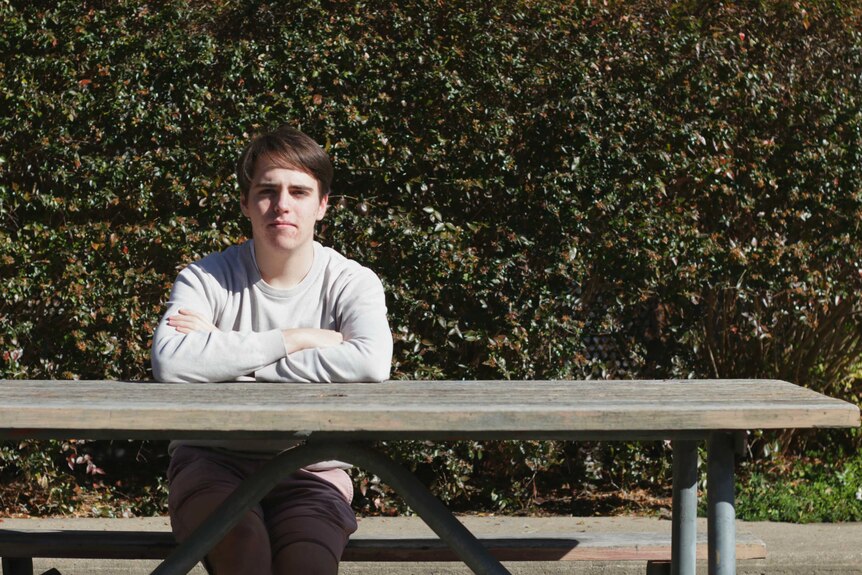 Andrew Topp sits at a bench.