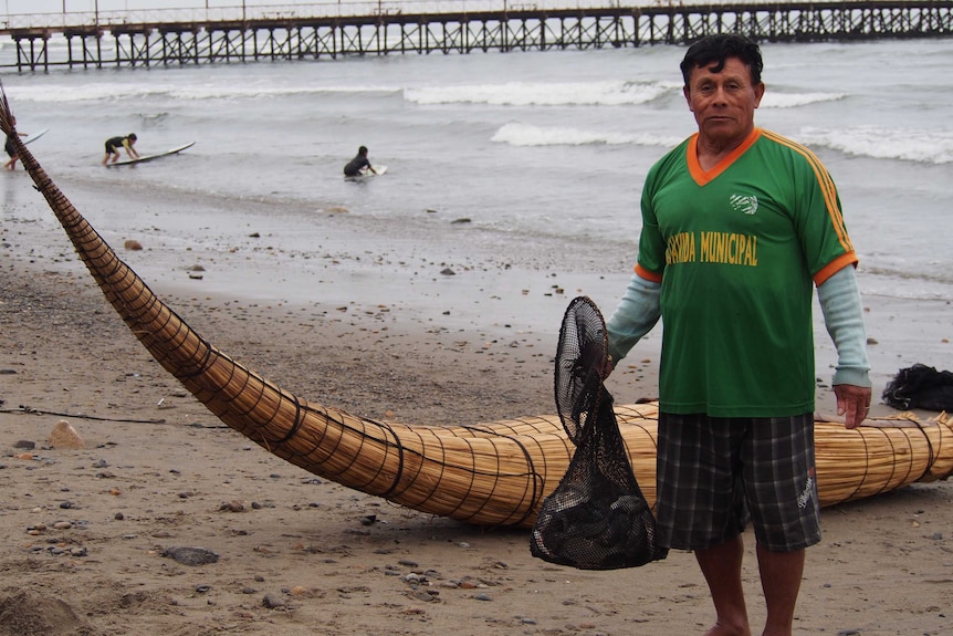 Huanchaco fisherman Victor Arzola uses his traditional cacallito de totora boat