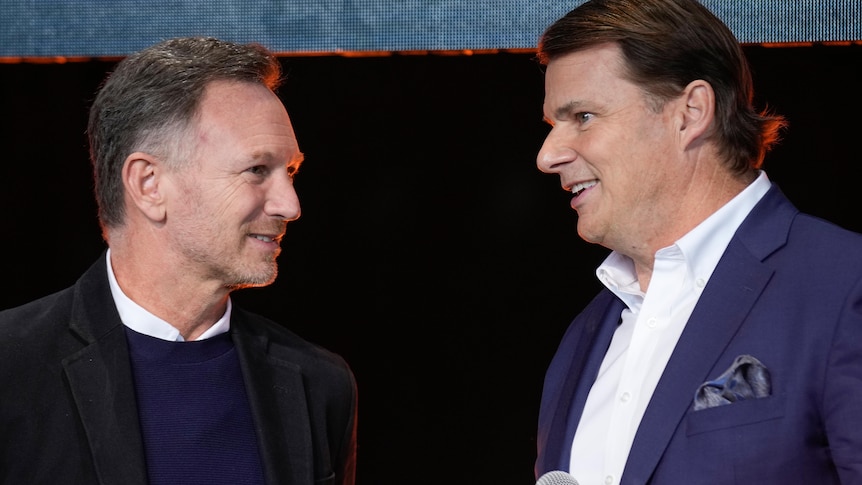 Christian Horner, team principal of the Red Bull Formula 1 team, left, talks with Ford CEO Jim Farley