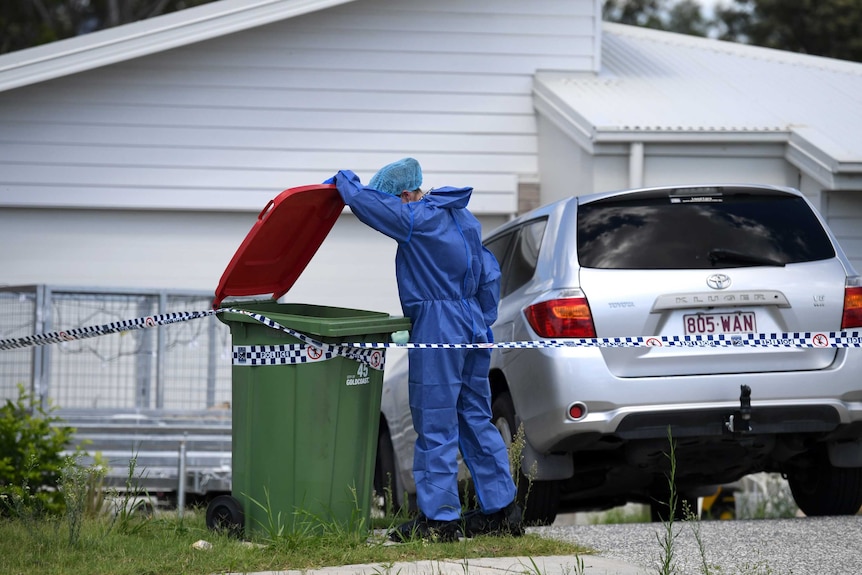 Police forensic officers examine a house in Pimpama on the Gold Coast, Tuesday, Jan. 31, 2017.