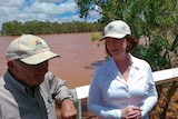 Julia Gillard chats to Tom Day, Carnarvon banana grower affected by floods, at the Nine Mile bridge