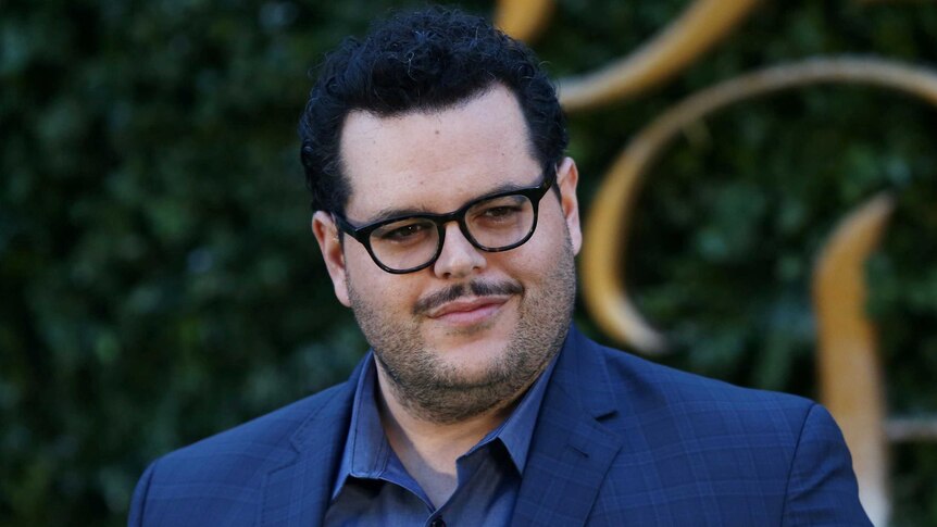Actor Josh Gad poses for photographers at a media event for the film Beauty and the Beast in London.