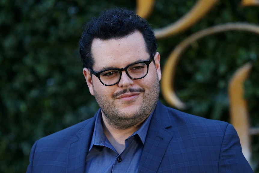 Actor Josh Gad poses for photographers at a media event for the film Beauty and the Beast in London.
