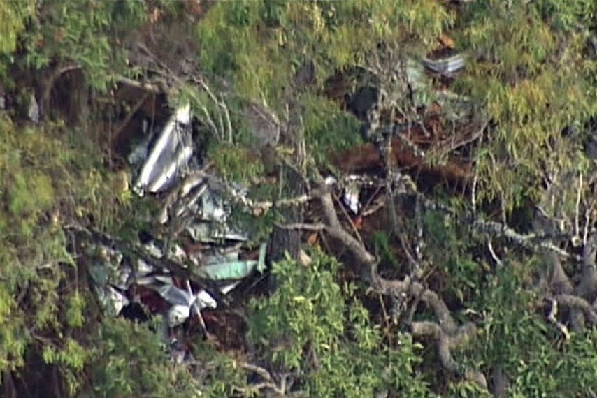 The plane crashed on the side of a hill in rugged terrain north of the Borumba Dam in Qld's Sunshine Coast hinterland.