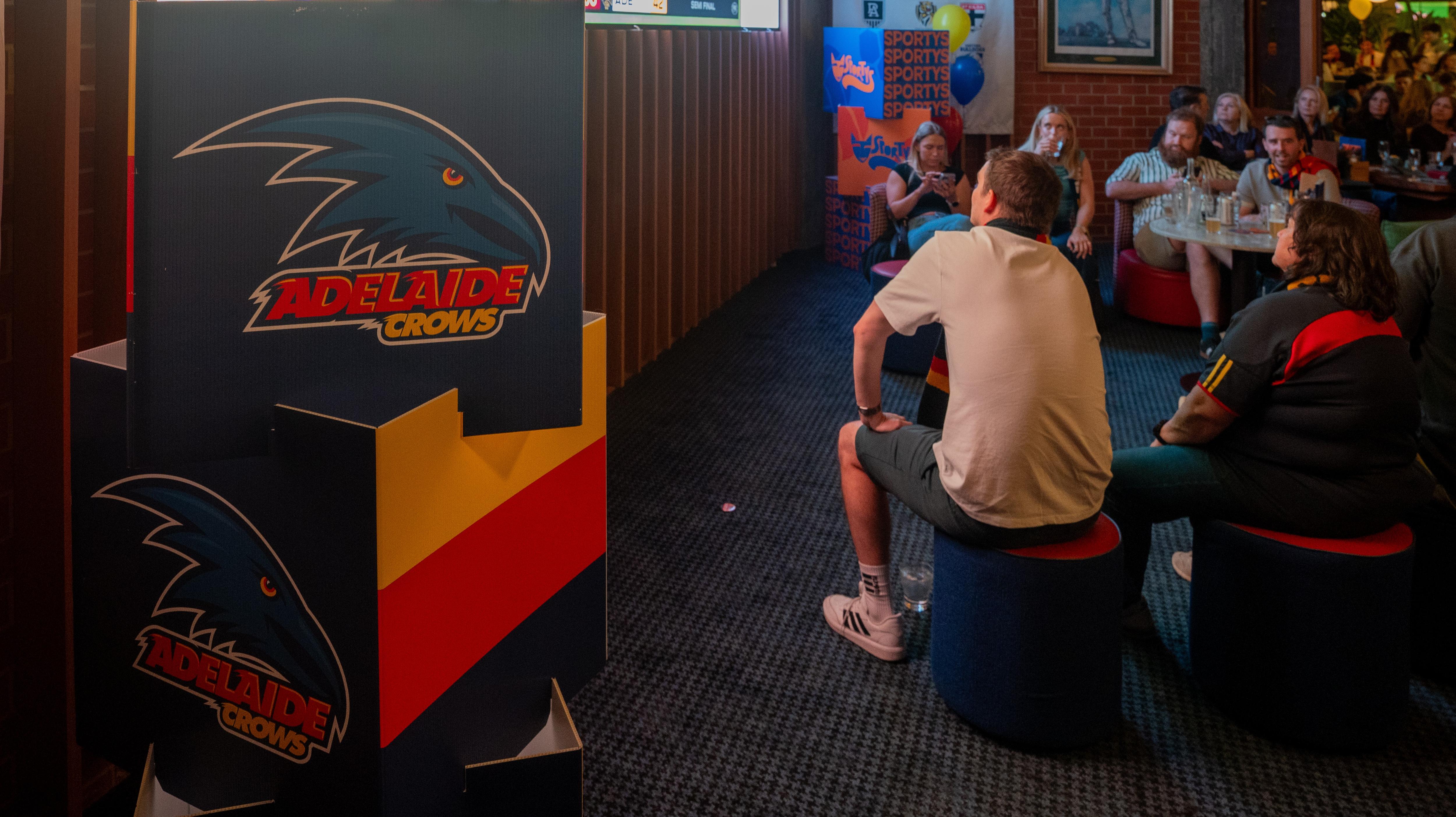'You've got to be loyal, good times and bad': Crows fans commiserate finals loss