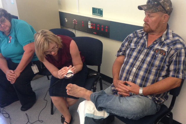 Staff at Charters Towers Hospital take photos of patient Micheal Glendinning using a 3D camera