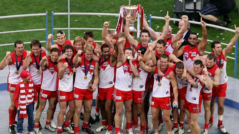 Sydney Swans players celebrate victory after the 2005 AFL Grand Final