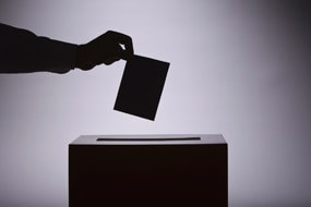 File photo: Person voting at the ballot box (Thinkstock: Comstock)