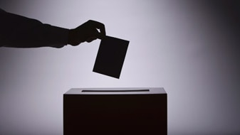 File photo: Person voting at the ballot box (Thinkstock: Comstock)