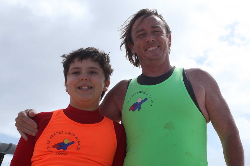 Open water instructor Pete Dunne with Oscar Fredericks, who has autism, and learnt to swim with Little Heroes
