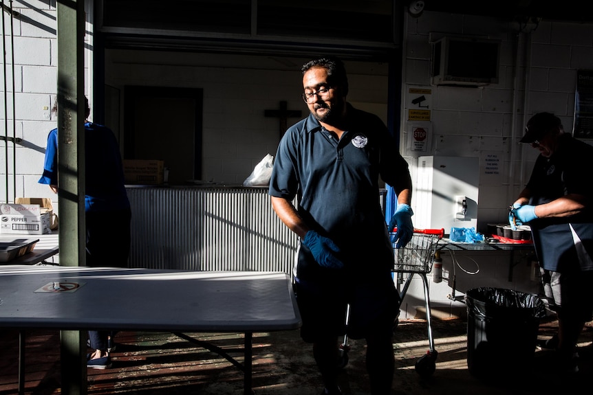 A photo of people preparing food.