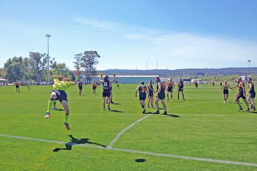 An umpire throws in from the sideline