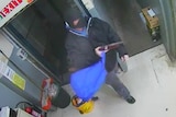 Security camera image of Dylan Elias Keenan during the Chapman supermarket robbery in August, 2013.