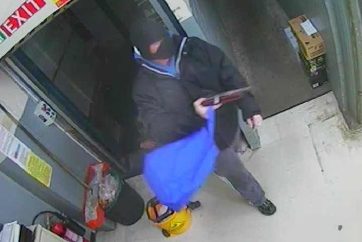 Security camera image of Dylan Elias Keenan during the Chapman supermarket robbery in August, 2013.
