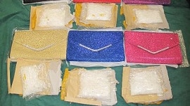 Hong Kong Customs say they found bags of suspected methamphetamine in the false compartments of seven handbags.