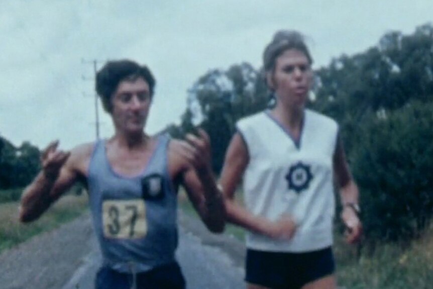 Fred Warwick gestures as he runs next to Adrienne.