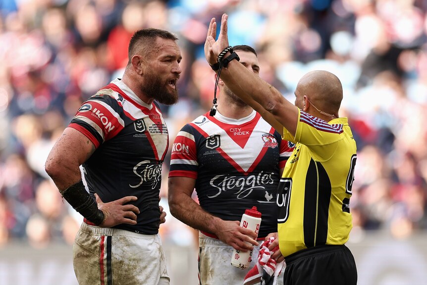 NRL referee Ashley Klein signals 10 minutes int he sin bin for Jared Waerea-Hargreaves of the Sydney Roosters.