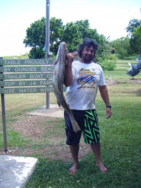 A man holding a recently caught fish