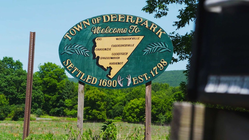 A sign says welcome to Deerpark.