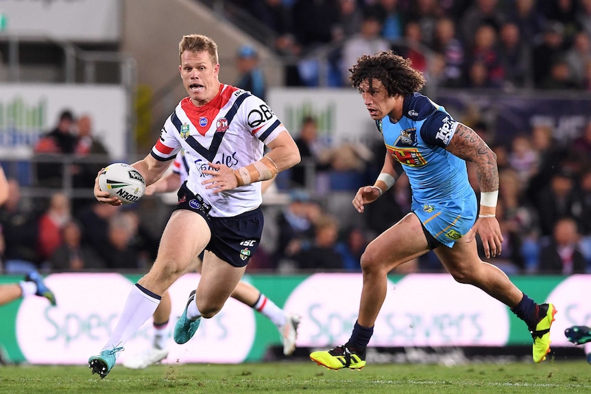 Lindsay Collins makes a break for the Roosters against the Titans in Robina.