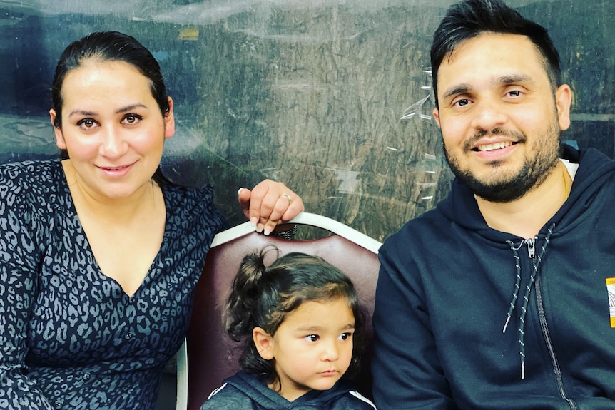 Jas Kaur and her husband, Kamal Bhatti, sit with their son, Anhad, between them.