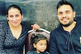 Jas Kaur and her husband, Kamal Bhatti, sit with their son, Anhad, between them.