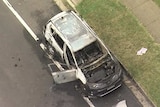 Aerial view of a burnt out car