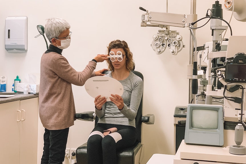 a woman is examined by an optometrist