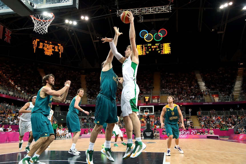 Too good ... Brazil's Tiago Splitter shoots over Australian forward Aleks Maric.