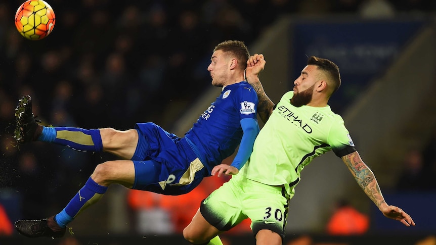 Jamie Vardy of Leicester City is challenged by Nicolas Otamendi